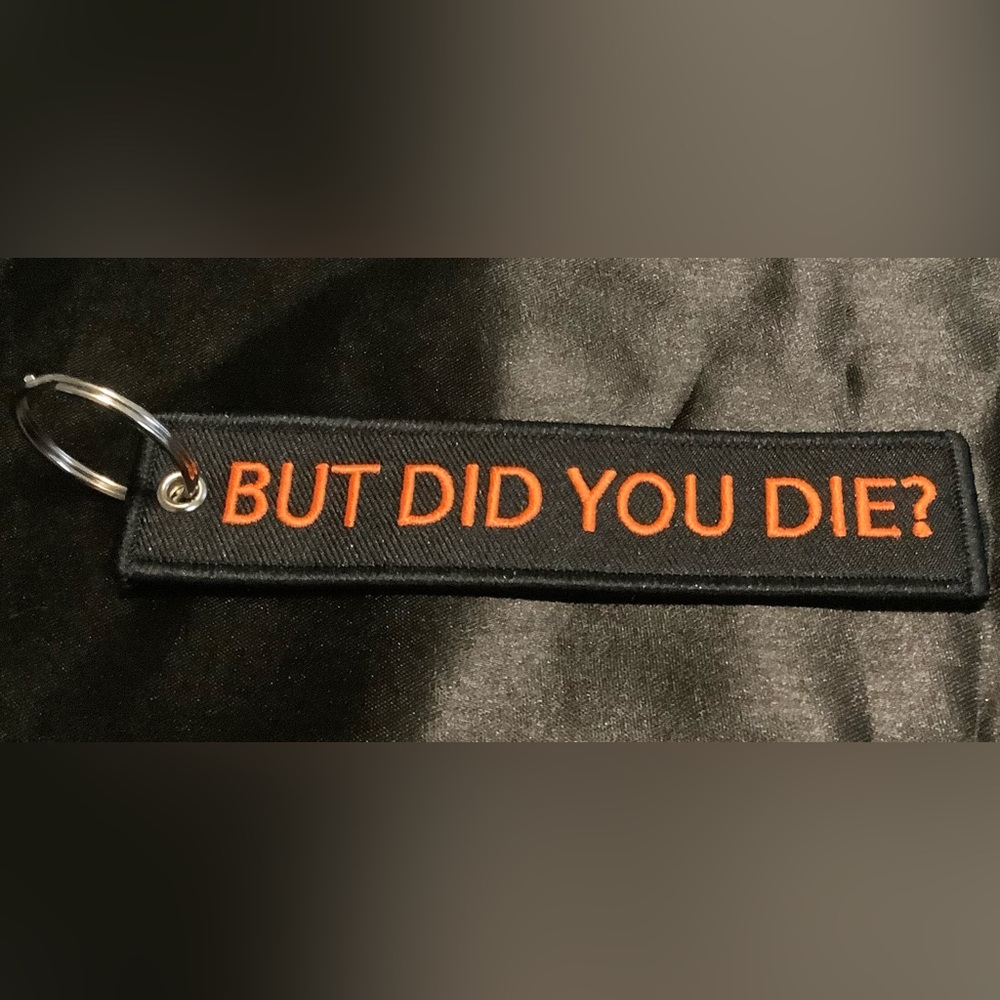 Black Keychain with Orange Text